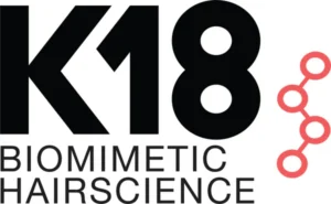 K18 Biomimetic Hairscience logo featuring bold black text and a pink molecular structure graphic on the right. Salon Noir in Cedarburg, WI -
